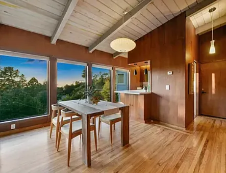 Dining area with windows on the trees