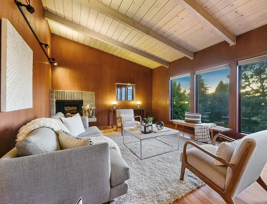 Living room with fireplace and redwood paneling