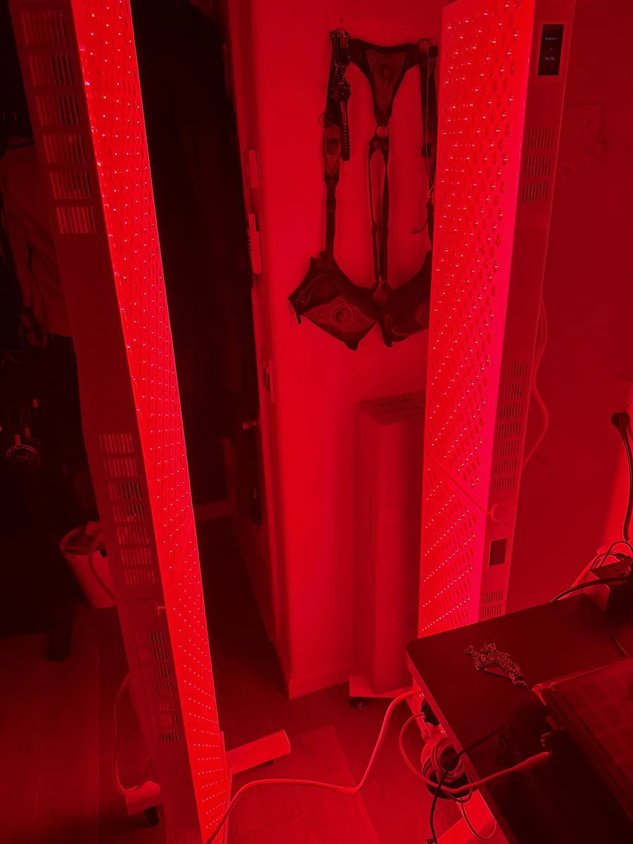 Two full-length red light panels glowing